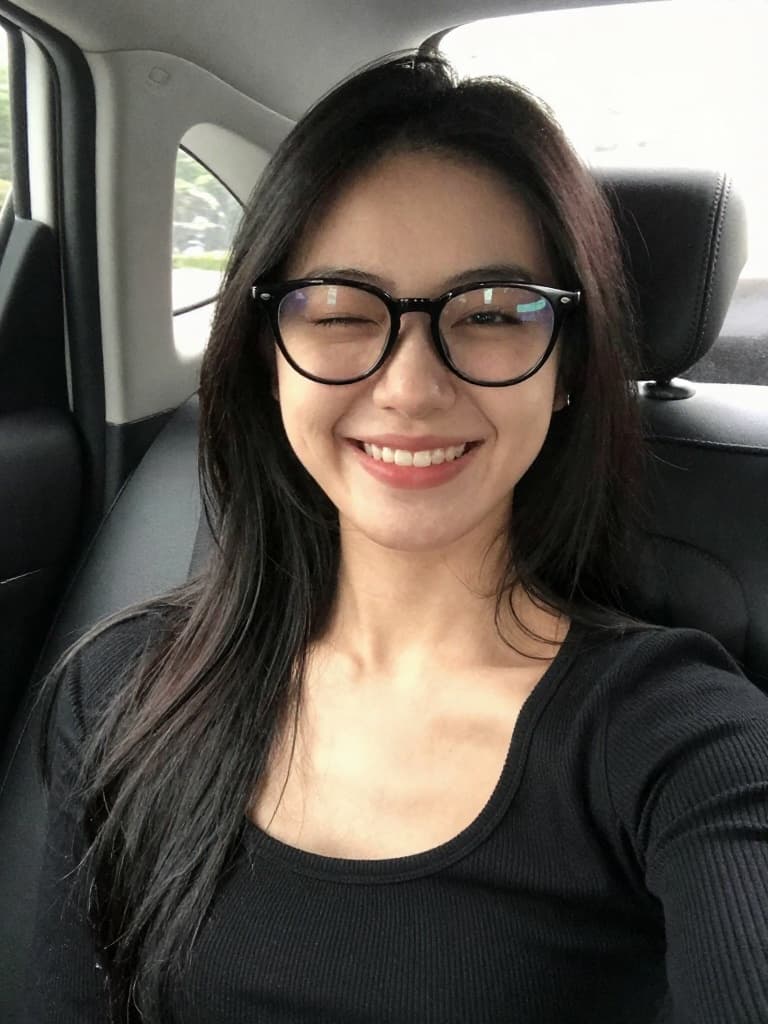 Casual smartphone selfie of a beautiful East Asian woman in her late…