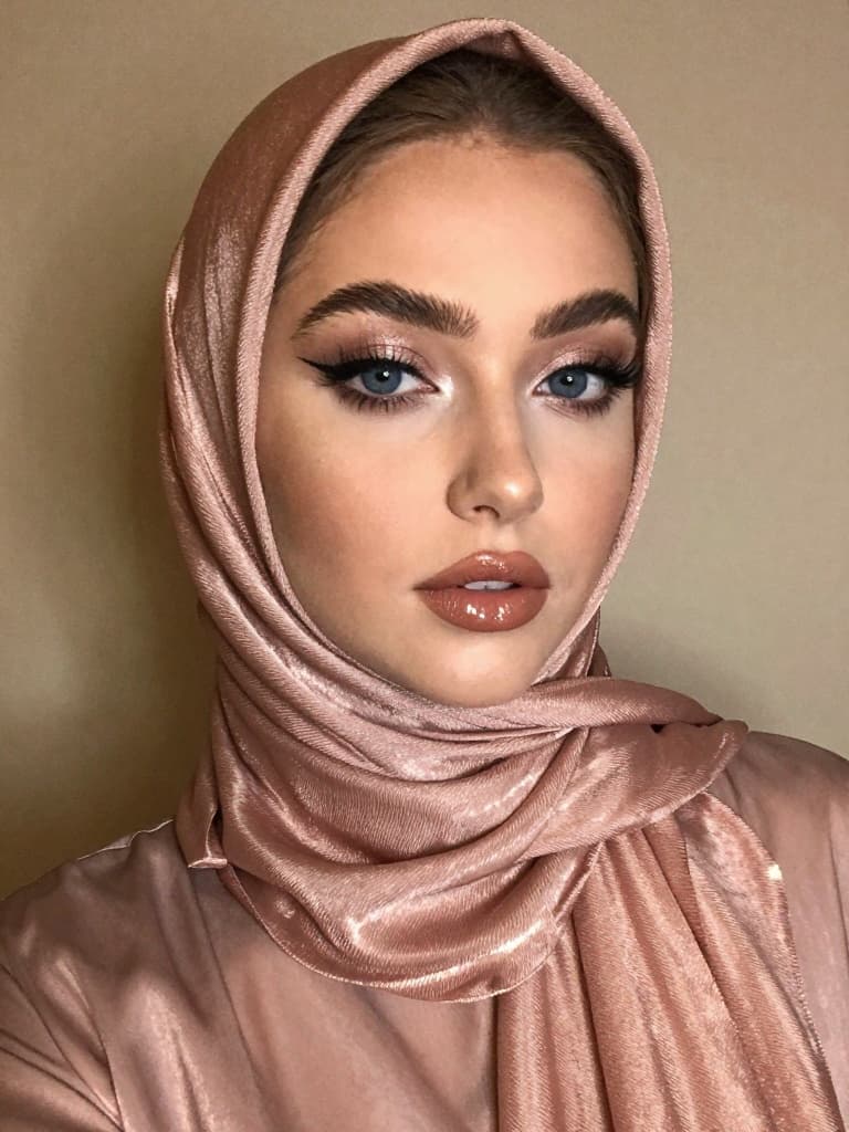 Smartphone selfie of a beautiful young caucasian woman with striking…