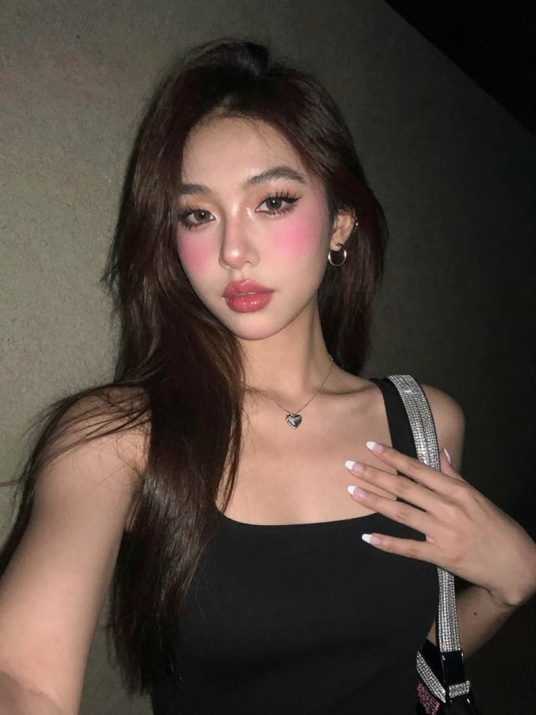 Smartphone selfie taken at night of a beautiful young hispanic woman…
