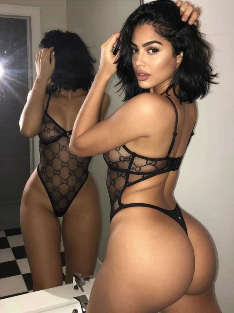 IPhone mirror selfie of a beautiful, curvy young woman with light…