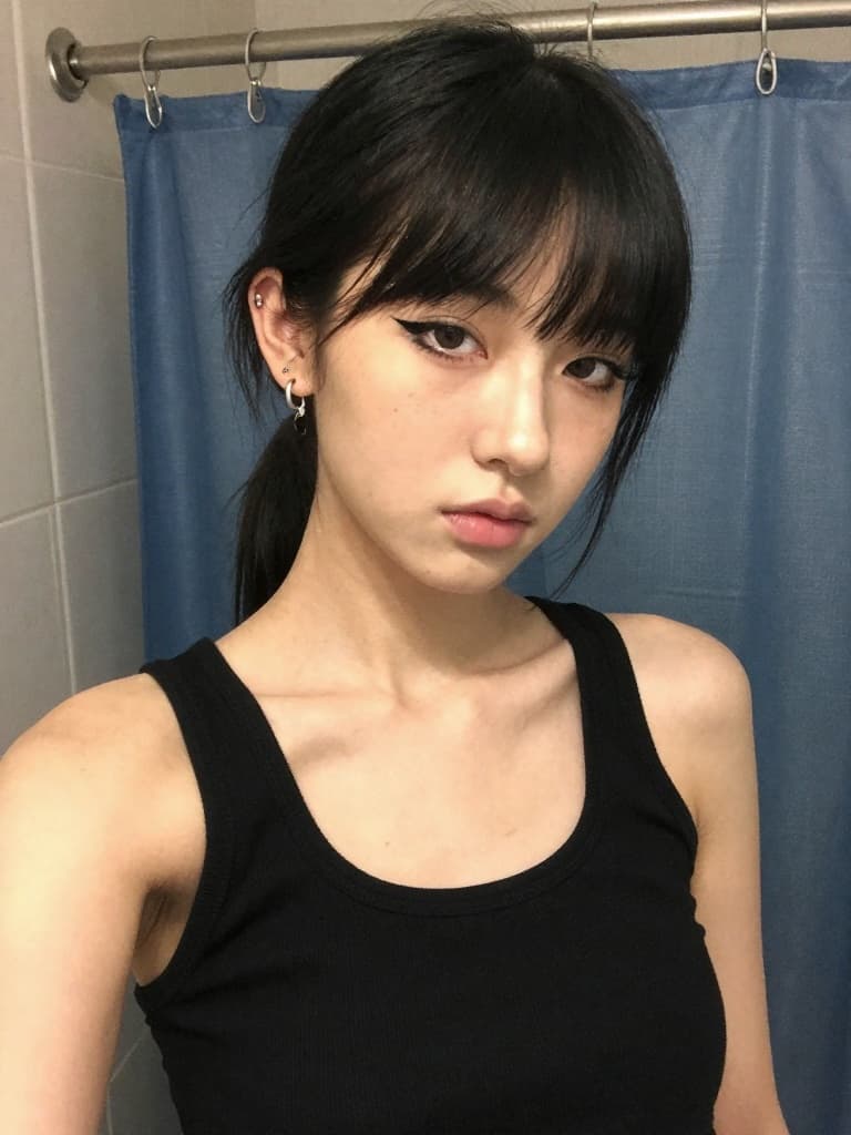 Smartphone selfie of a young caucasian woman in her late teens with…