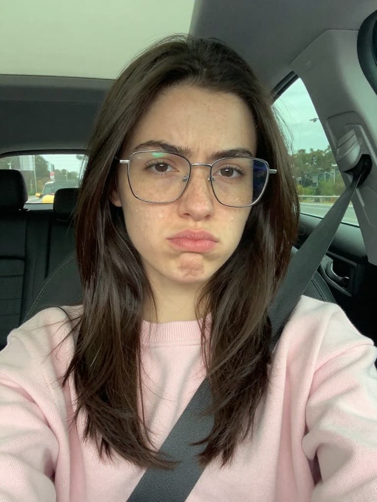 Unfiltered smartphone selfie of a young caucasian woman in her early…